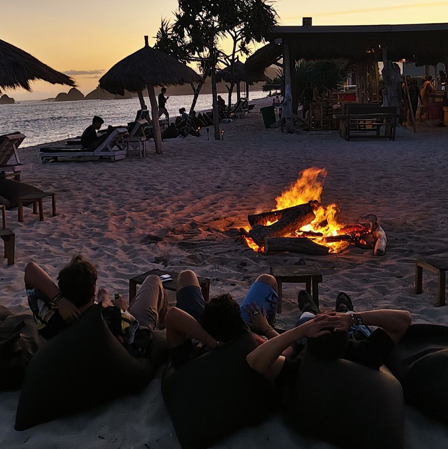 THE SUNSETS COLOR THE FLAMES OF THE CAMPFIRE